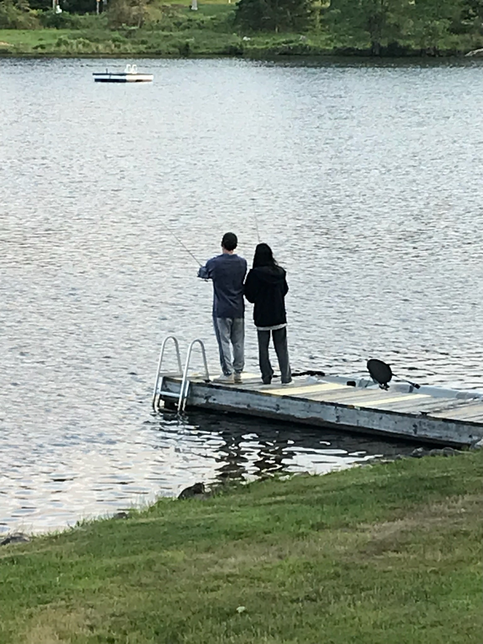 Jake teaching Ana to fish